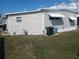 A well-maintained residence with neutral siding and a neat yard space at 1750 Palm Springs St, Sarasota, FL 34234