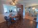 Cozy dining area with stone-look flooring and a view of the open concept living room at 1750 Palm Springs St, Sarasota, FL 34234