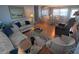 Inviting living room featuring sofas, dining area with a glass table, and a view from above at 1750 Palm Springs St, Sarasota, FL 34234
