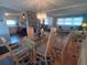 Open-concept living room featuring a dining area with a chandelier and a view into the kitchen at 1750 Palm Springs St, Sarasota, FL 34234