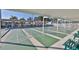 Community shuffleboard courts with benches and shaded seating for players and spectators at 1750 Palm Springs St, Sarasota, FL 34234