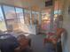 Bright sunroom featuring comfortable seating, ample natural light, and a relaxing ambiance at 1750 Palm Springs St, Sarasota, FL 34234