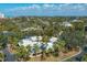 Aerial view of neighborhood featuring lush landscaping and waterfront access on a sunny day at 231 Hourglass Way # V5, Sarasota, FL 34242