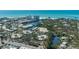 Stunning aerial view of neighborhood, showcasing landscaping, waterfront access, and community layout at 231 Hourglass Way # V5, Sarasota, FL 34242