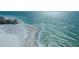 Expansive beach view with crystal clear turquoise water on a sunny day at 231 Hourglass Way # V5, Sarasota, FL 34242