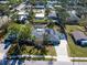Charming home featuring solar panels, an in-ground pool, fenced yard and a beautiful driveway at 2376 Novus St, Sarasota, FL 34237