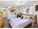 Bedroom featuring wood floors, ceiling fan, and closet space at 2376 Novus St, Sarasota, FL 34237