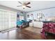 A bedroom featuring wood floors, ceiling fan, and decor on the walls at 2376 Novus St, Sarasota, FL 34237
