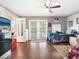 Bedroom with wood floors, ceiling fan and doors leading to the outside at 2376 Novus St, Sarasota, FL 34237