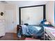 Cozy bedroom with hardwood floors, closet, and white door at 2376 Novus St, Sarasota, FL 34237
