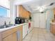 Kitchen featuring wood cabinets, stainless steel sink, and appliances at 2376 Novus St, Sarasota, FL 34237