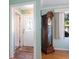 Hallway view featuring a grandfather clock, neutral wall color, and natural light at 2376 Novus St, Sarasota, FL 34237
