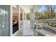 A spacious balcony with patio seating adjoins the beautifully decorated bedroom at 250 Sands Point Rd # 5101, Longboat Key, FL 34228