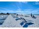 Expansive beach with lounge chairs and umbrellas, offering a serene escape by the beautiful ocean at 250 Sands Point Rd # 5101, Longboat Key, FL 34228