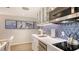 Kitchenette with stainless steel appliances, counter space and blue backsplash at 250 Sands Point Rd # 5101, Longboat Key, FL 34228