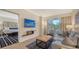 Open-concept living space with dining area, and view to bedroom and patio at 250 Sands Point Rd # 5101, Longboat Key, FL 34228