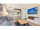 Living space with sleeper sofa, entertainment center and kitchenette at 250 Sands Point Rd # 5101, Longboat Key, FL 34228