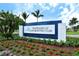 Entrance sign for The Resort at Longboat Key Club, surrounded by lush greenery and flowers at 250 Sands Point Rd # 5101, Longboat Key, FL 34228