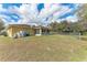 Expansive backyard with chain-link fence and ample room for outdoor activities at 2720 Dode Ave, North Port, FL 34288