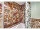 Detailed bathroom with a tub, shower, and striking marble tile work throughout the shower at 2812 Casey Key Rd, Nokomis, FL 34275