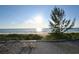 Picturesque beach with a bench offering serene views of the ocean and skyline at 2812 Casey Key Rd, Nokomis, FL 34275