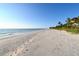 Beautiful beachfront showcasing soft sand and a clear horizon near a coastal home at 2812 Casey Key Rd, Nokomis, FL 34275