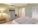 Bedroom with a bed, dressers and a TV for relaxation and entertainment at 2812 Casey Key Rd, Nokomis, FL 34275