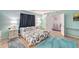 Airy bedroom with a large bed, and a door to another room, creating a comfortable and inviting retreat at 2812 Casey Key Rd, Nokomis, FL 34275