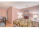 Comfortable bedroom with a leafy patterned bedspread, side tables with lamps, and tile flooring at 2812 Casey Key Rd, Nokomis, FL 34275