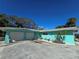 This home has a two-car garage and a well-maintained exterior, surrounded by mature trees at 2812 Casey Key Rd, Nokomis, FL 34275