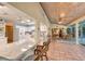 Open kitchen with breakfast bar and bright white cabinets at 2812 Casey Key Rd, Nokomis, FL 34275