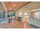 Open living area with tiled floor and a view into the bright kitchen at 2812 Casey Key Rd, Nokomis, FL 34275