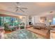 Inviting living room with fireplace, comfortable seating, tile floors, and scenic outdoor views at 2812 Casey Key Rd, Nokomis, FL 34275