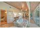 Open concept living space with tile floors and view into the kitchen at 2812 Casey Key Rd, Nokomis, FL 34275
