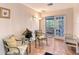 Cozy sitting area with tile flooring, comfortable chairs, and a glass table, providing an inviting space for relaxation at 2812 Casey Key Rd, Nokomis, FL 34275