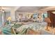Spacious living room featuring plush seating, tile floors, and views of the lanai at 2812 Casey Key Rd, Nokomis, FL 34275