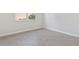 Bright bedroom with wood-look tile flooring and a large window at 3294 Gowanda Ave, North Port, FL 34287