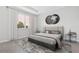 Comfortable bedroom with large window, plush rug, and contemporary decor at 3294 Gowanda Ave, North Port, FL 34287