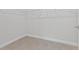 Walk-in closet featuring ample storage and tile flooring at 3294 Gowanda Ave, North Port, FL 34287