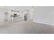 Open floor plan with stainless steel appliances, a kitchen island, and bright lighting at 3294 Gowanda Ave, North Port, FL 34287