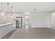 Bright open floorplan featuring modern kitchen, stainless appliances, and beautiful tile flooring at 3294 Gowanda Ave, North Port, FL 34287
