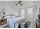 Bright bedroom featuring a ceiling fan, ensuite bathroom, and walk-in closet at 4529 Crowell Ln, North Port, FL 34288