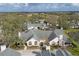 Spacious property featuring a well-maintained lawn, mature trees, and a large driveway at 4563 Whirlaway Dr # C, Sarasota, FL 34233