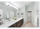 Bathroom boasts double sinks, sleek countertops, and separate shower stall at 4563 Whirlaway Dr # C, Sarasota, FL 34233