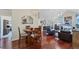 Dining area with wood table and chairs, seamlessly connected to the living room area at 4563 Whirlaway Dr # C, Sarasota, FL 34233