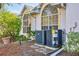 Exterior of home featuring AC unit and manicured landscaping at 4563 Whirlaway Dr # C, Sarasota, FL 34233