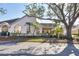 Inviting villa showcasing a well-manicured lawn, mature trees, and a charming exterior at 4563 Whirlaway Dr # C, Sarasota, FL 34233