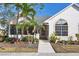Charming home with lush landscaping, mature trees, and a welcoming entrance at 4563 Whirlaway Dr # C, Sarasota, FL 34233