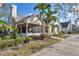 Charming home with lush landscaping, mature trees, and a welcoming screened-in porch at 4563 Whirlaway Dr # C, Sarasota, FL 34233