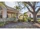 Charming villa showcasing lush landscaping and a cozy screened-in porch perfect for enjoying the outdoors at 4563 Whirlaway Dr # C, Sarasota, FL 34233